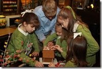 Matthew and the littles decorating the gingerbread house!